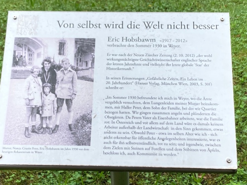 A photo of an information board, with the title ‘Von selbst wird die Welt nicht besser’ [the world won’t improve on its own], with a photo of a woman and three children from c.1930, and a lot of text, some of which is quoted in the post.